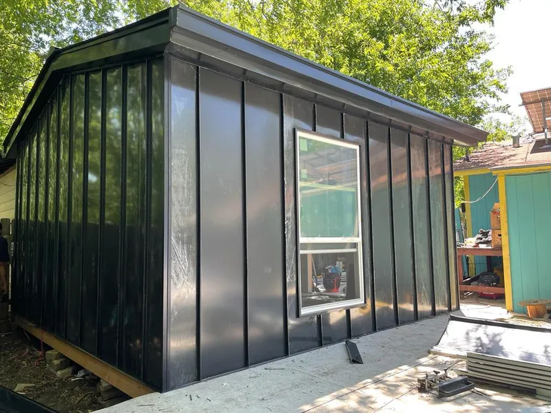 Black standing seam metal wall panels for Roof Inspection in Belleview